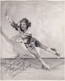 Reckless Rose Piccola, executes a two-wheel turn while traveling full speed ahead (Photograph with dedicace signed)